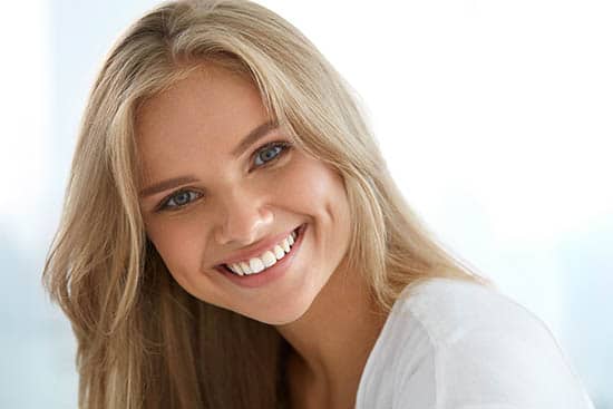 Beauty Woman Portrait. Girl With Beautiful Face Smiling after dental care